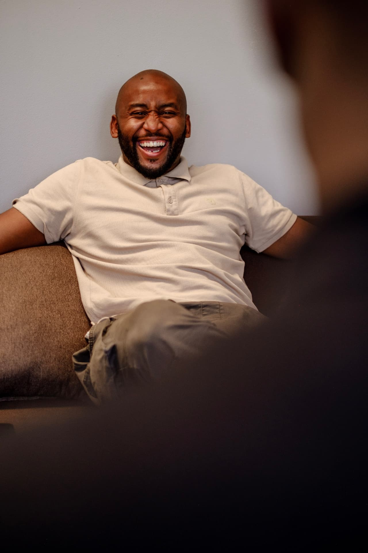 Obert Rukato sharing a warm, candid moment during a session